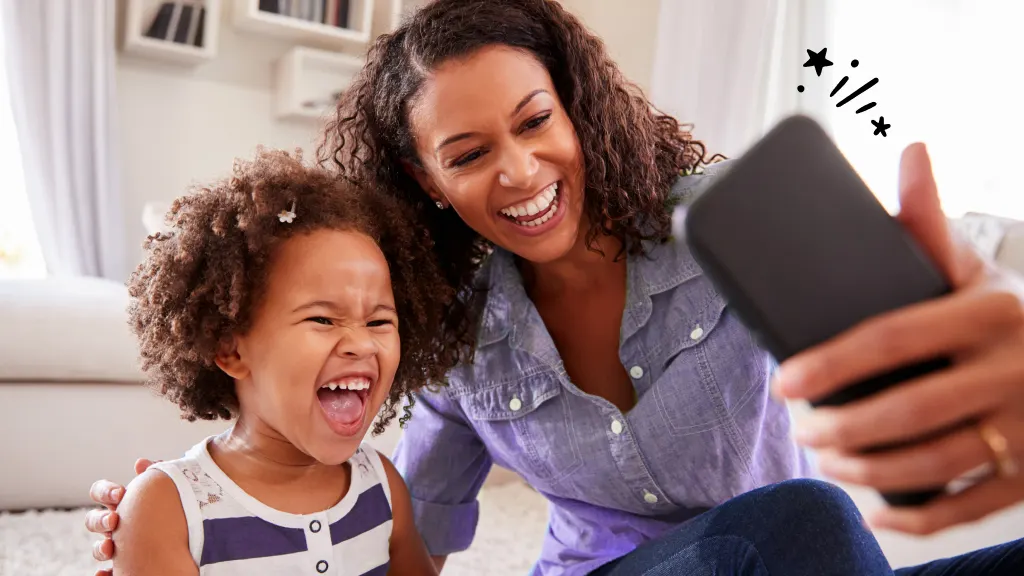 Parent taking selfie with child