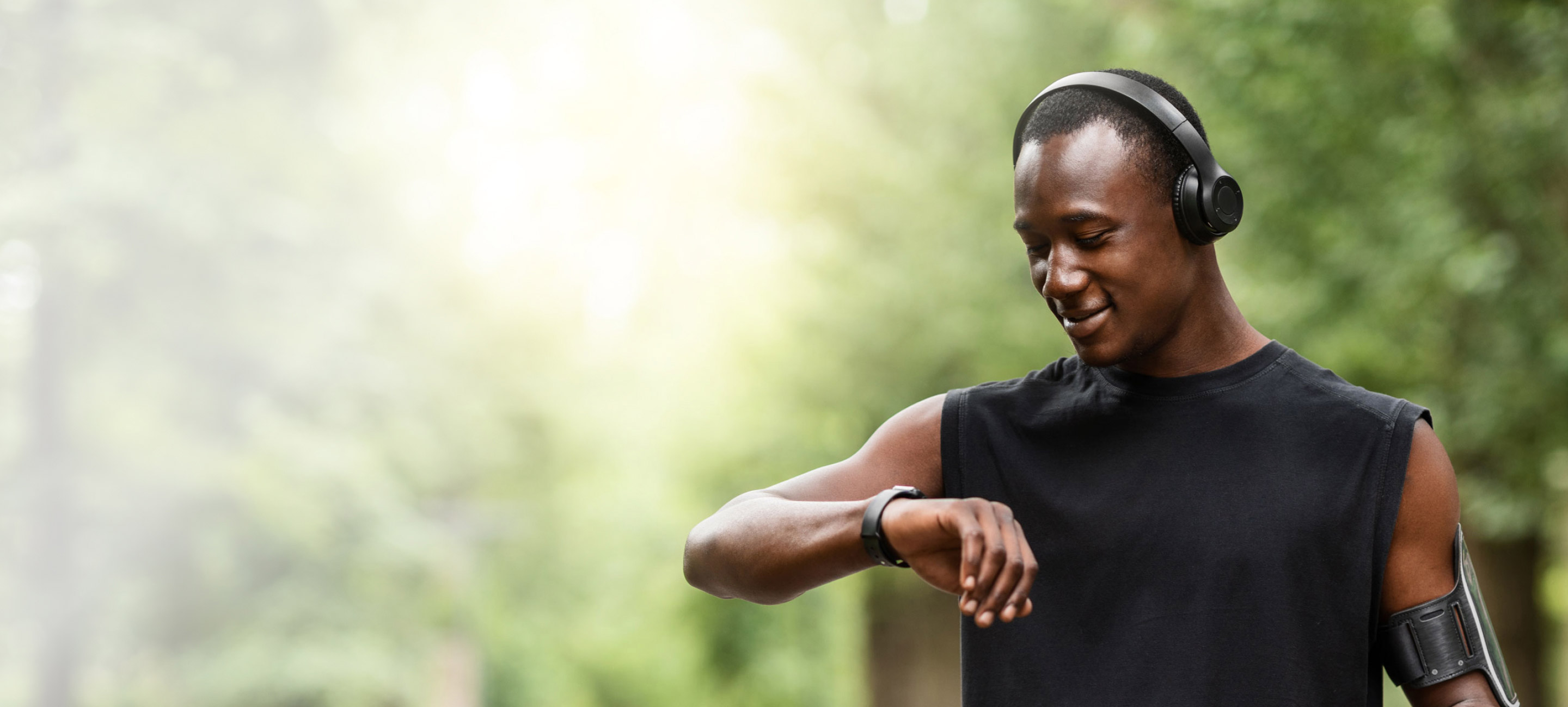 male looking at his smart watch