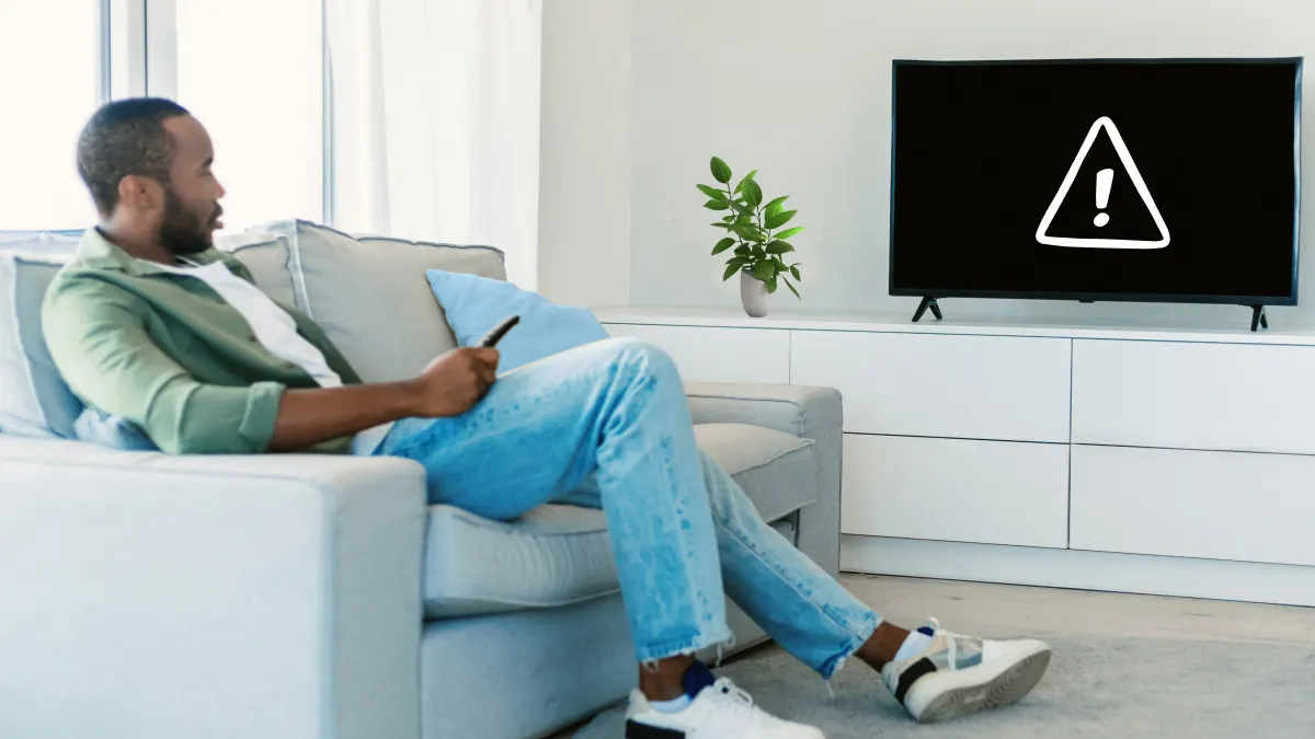 Man trying to watch TV but the screen is black