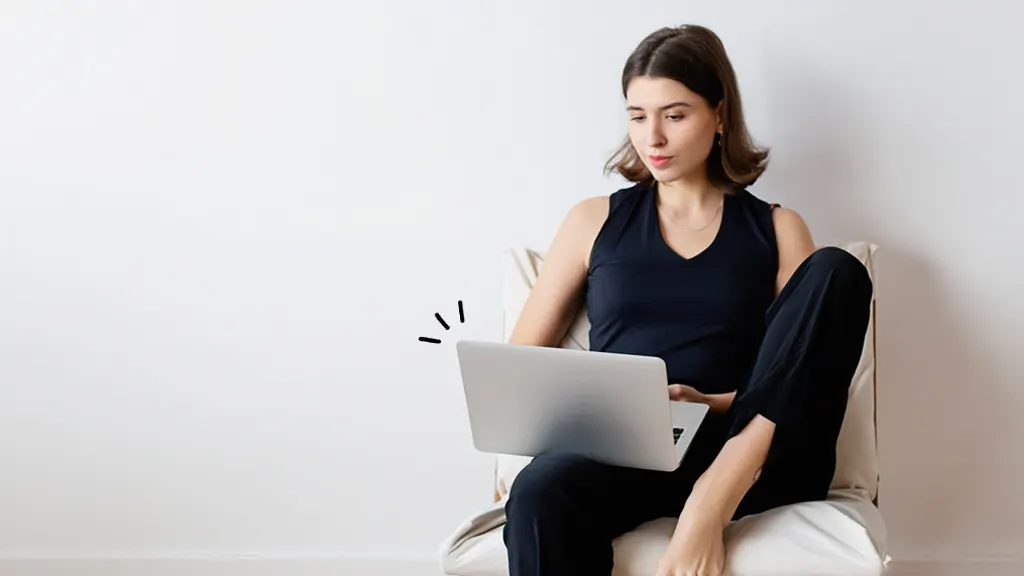 Woman changing the password on her MacBook