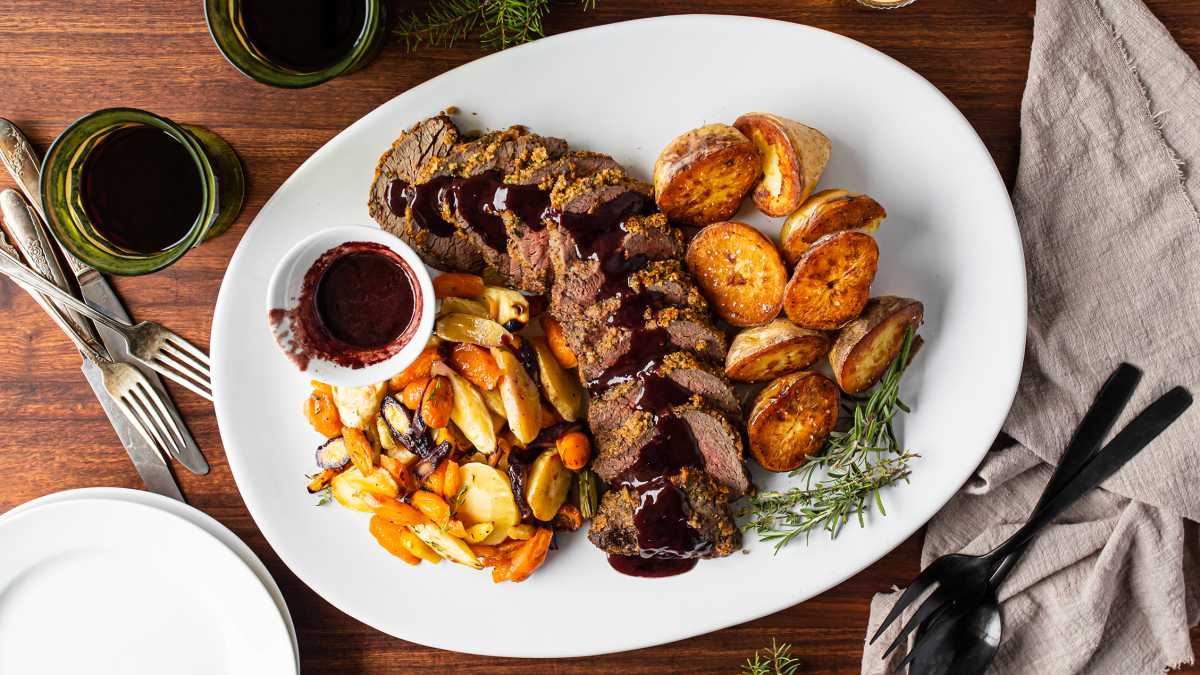 Herb-Crusted Beef Tenderloin with Red Wine Pan Sauce Photo