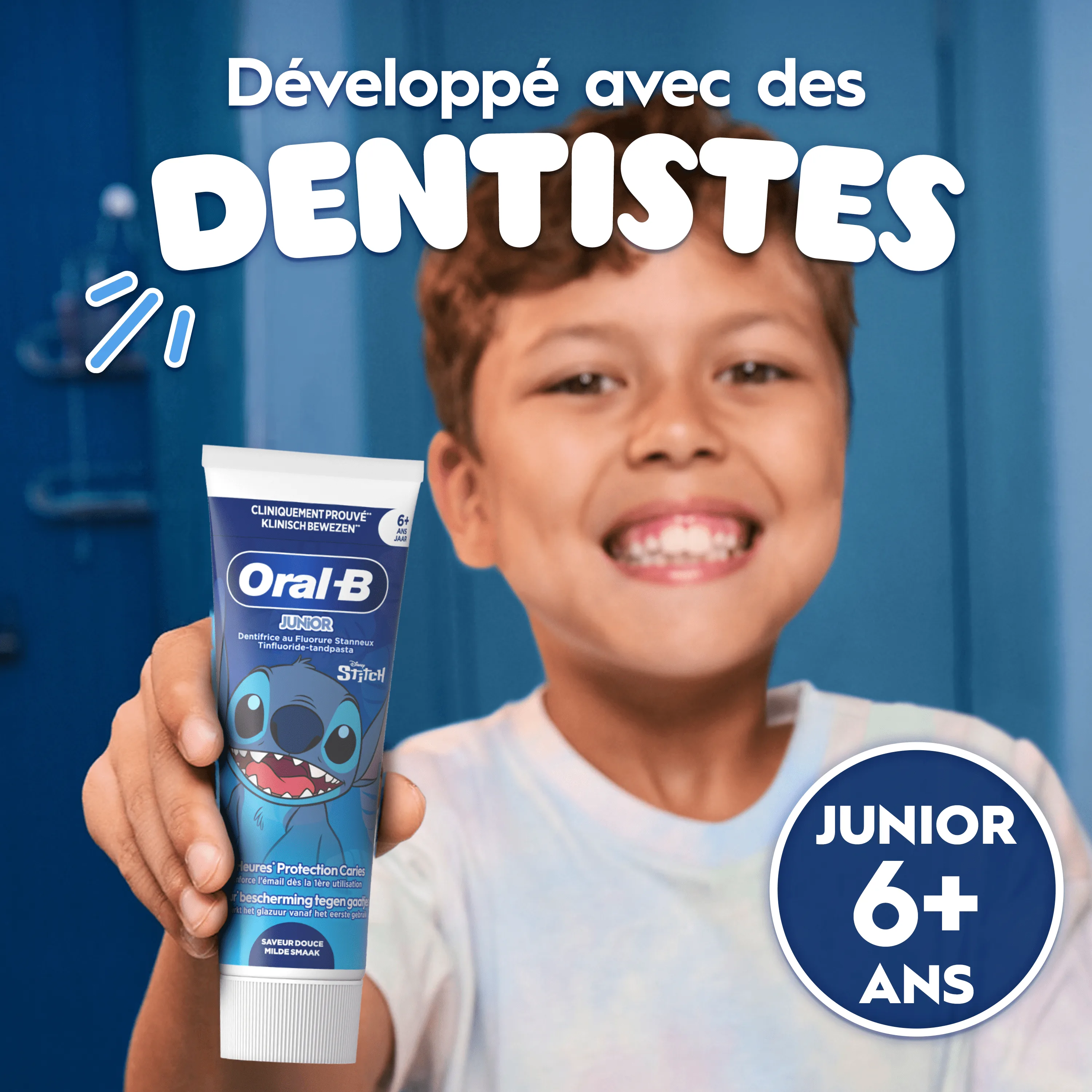Dentifrice Oral-B. Garçon tenant tube et brosse. « Développé avec des dentistes. » « Junior 6+ »