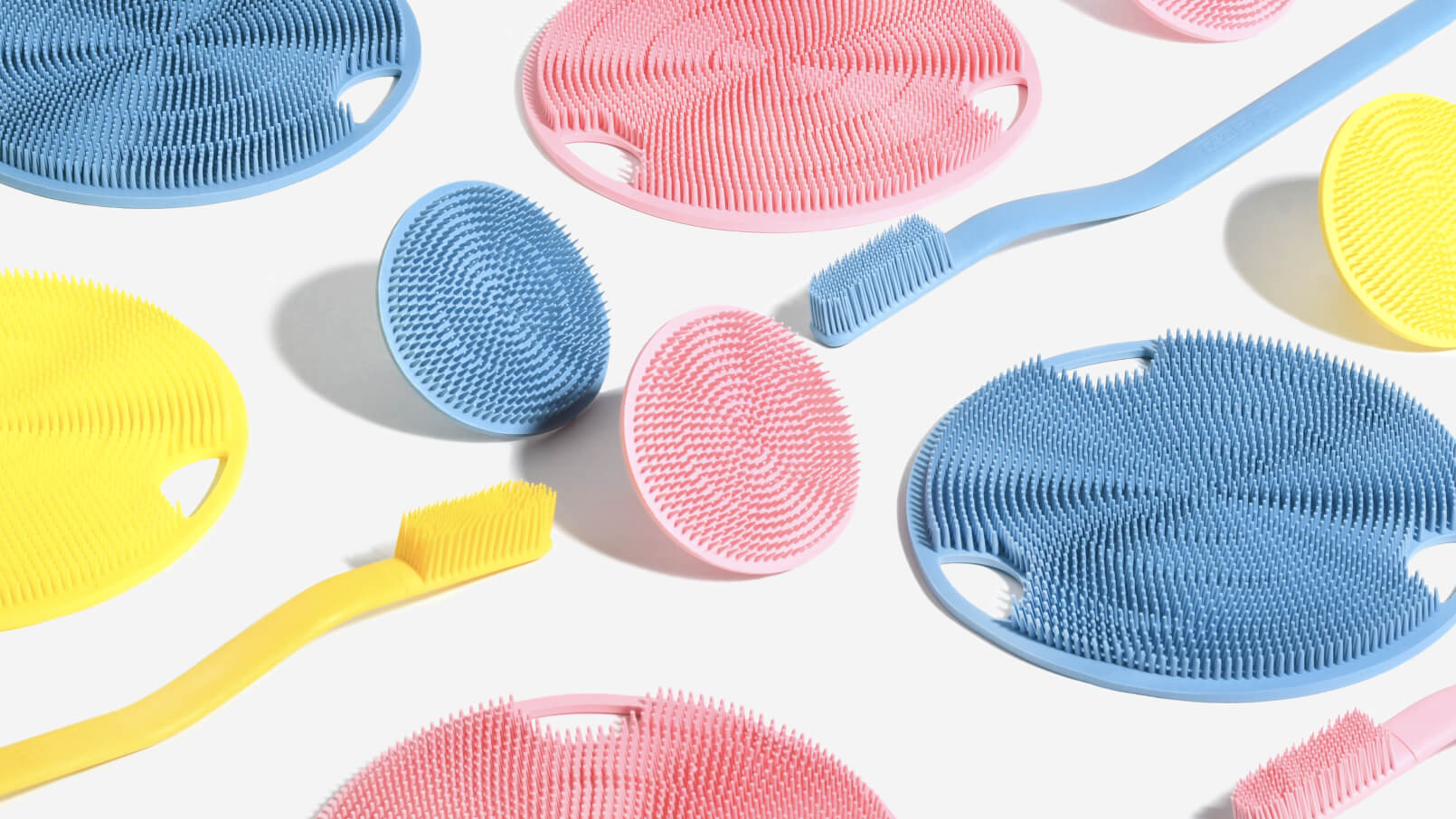 A colorful array of Boie toothbrushes, face scrubbers, and body scrubbers.