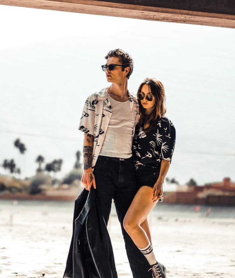 A man and woman pose in white and black P&Co apparel