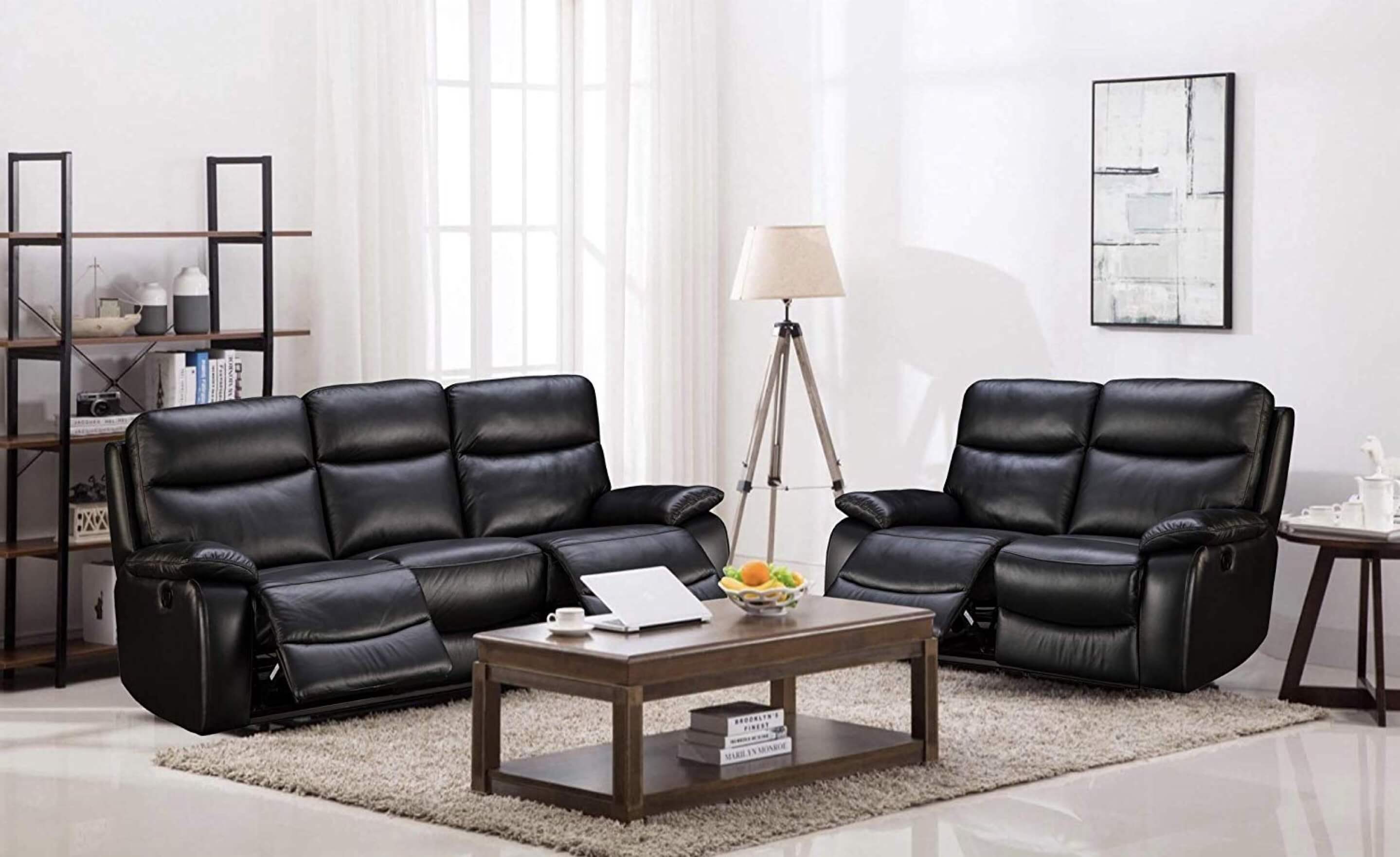 A comfortable, leather black sofa in a trendy living room.