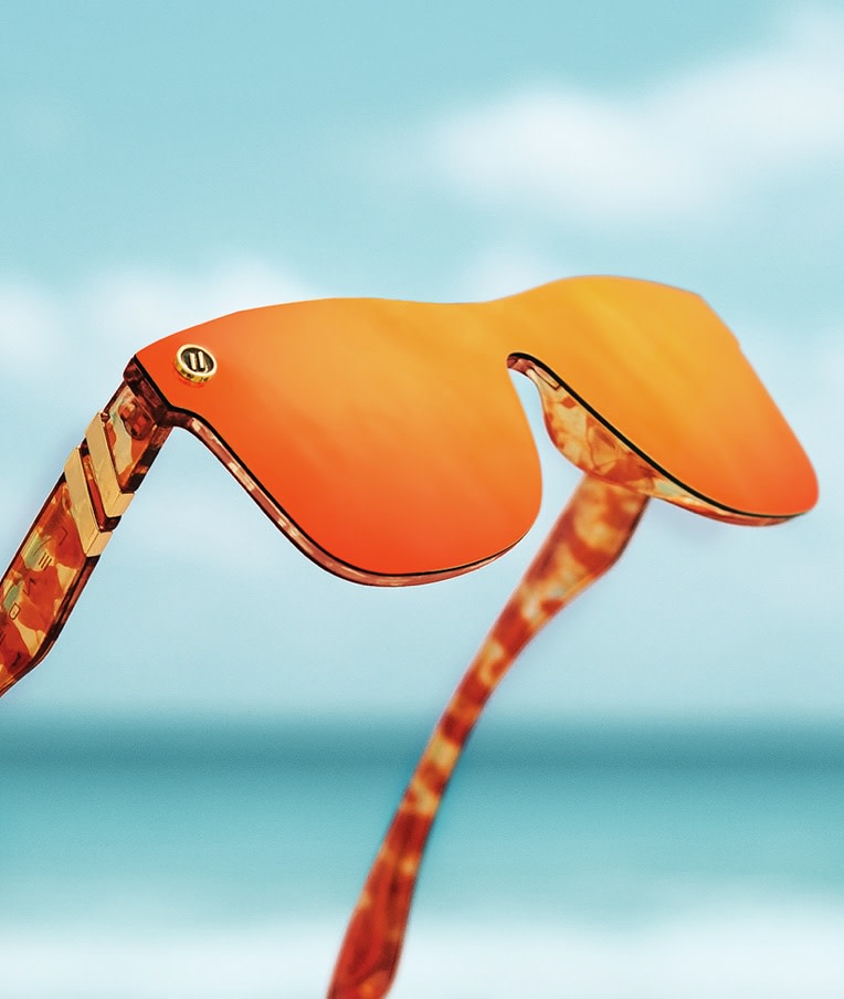 A stylish pair of orange mirror tinted sunglasses.