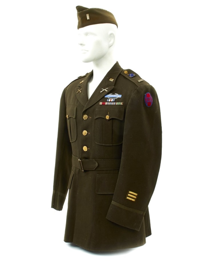 An army green military uniform is displayed on a mannequin.