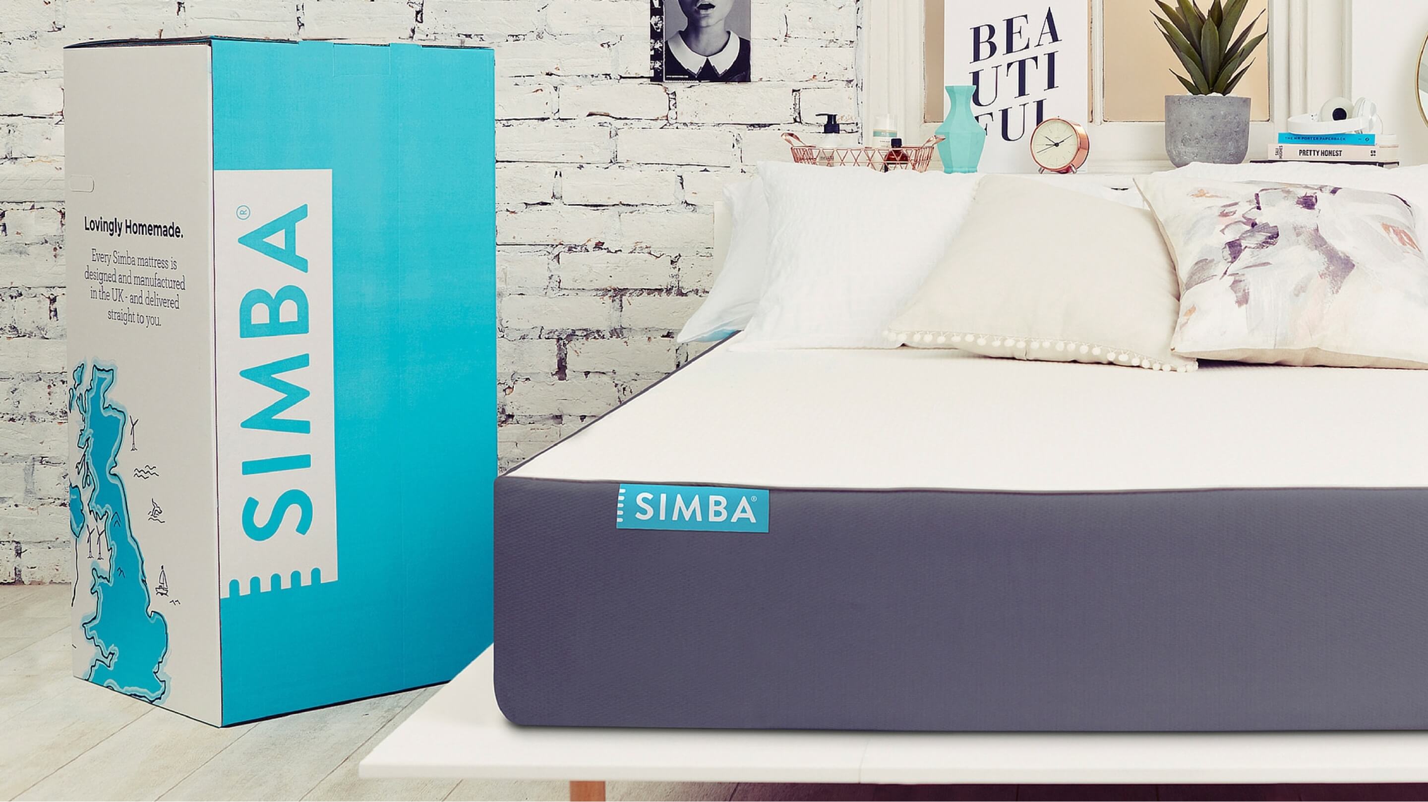 A Simba mattress rolled out from the box and laid out beautifully on a bed frame.