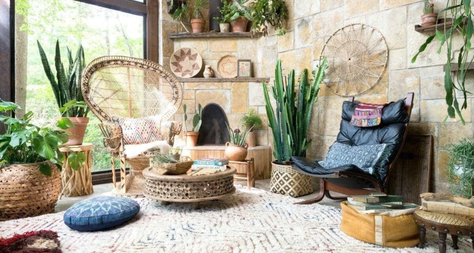 A rustic, jungle-themed living space is framed by cactus plants and a cream throw rug.