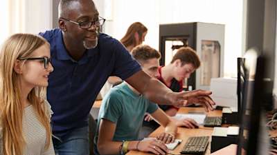 University professor helping student with engineering software