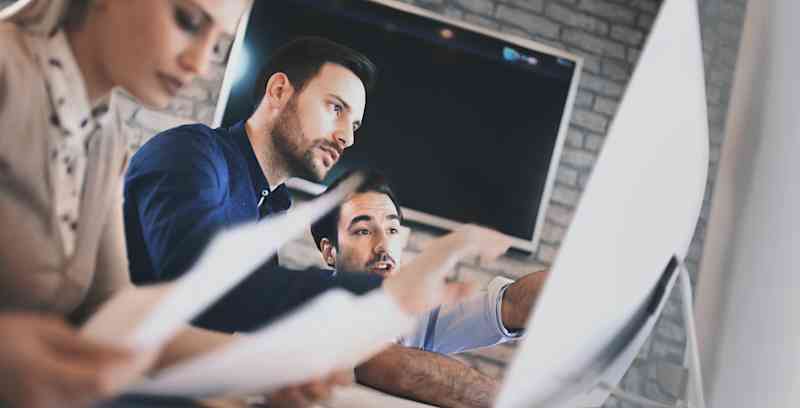 Tech workers working on an audit