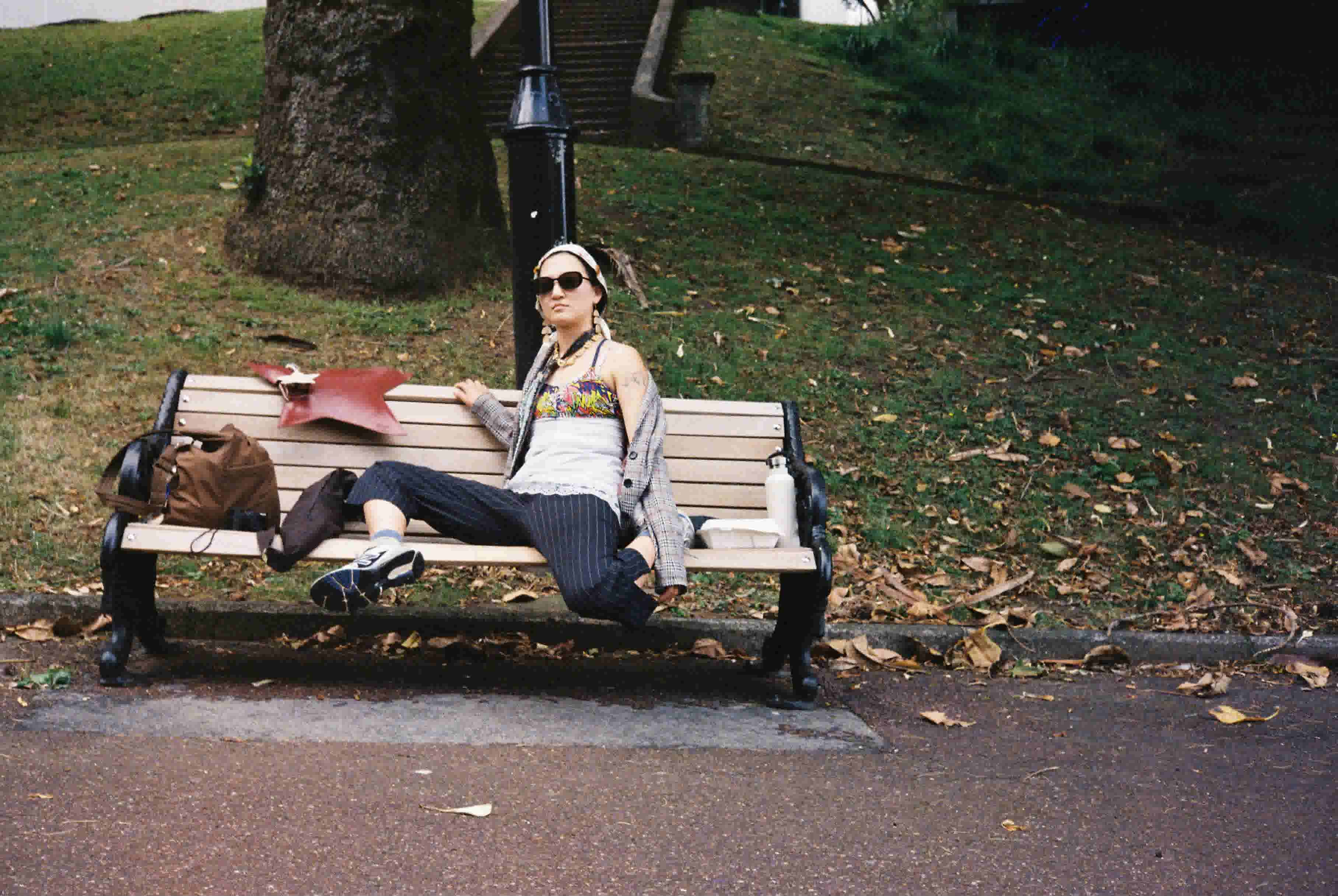 Cindy sitting on a bench in Myers Park