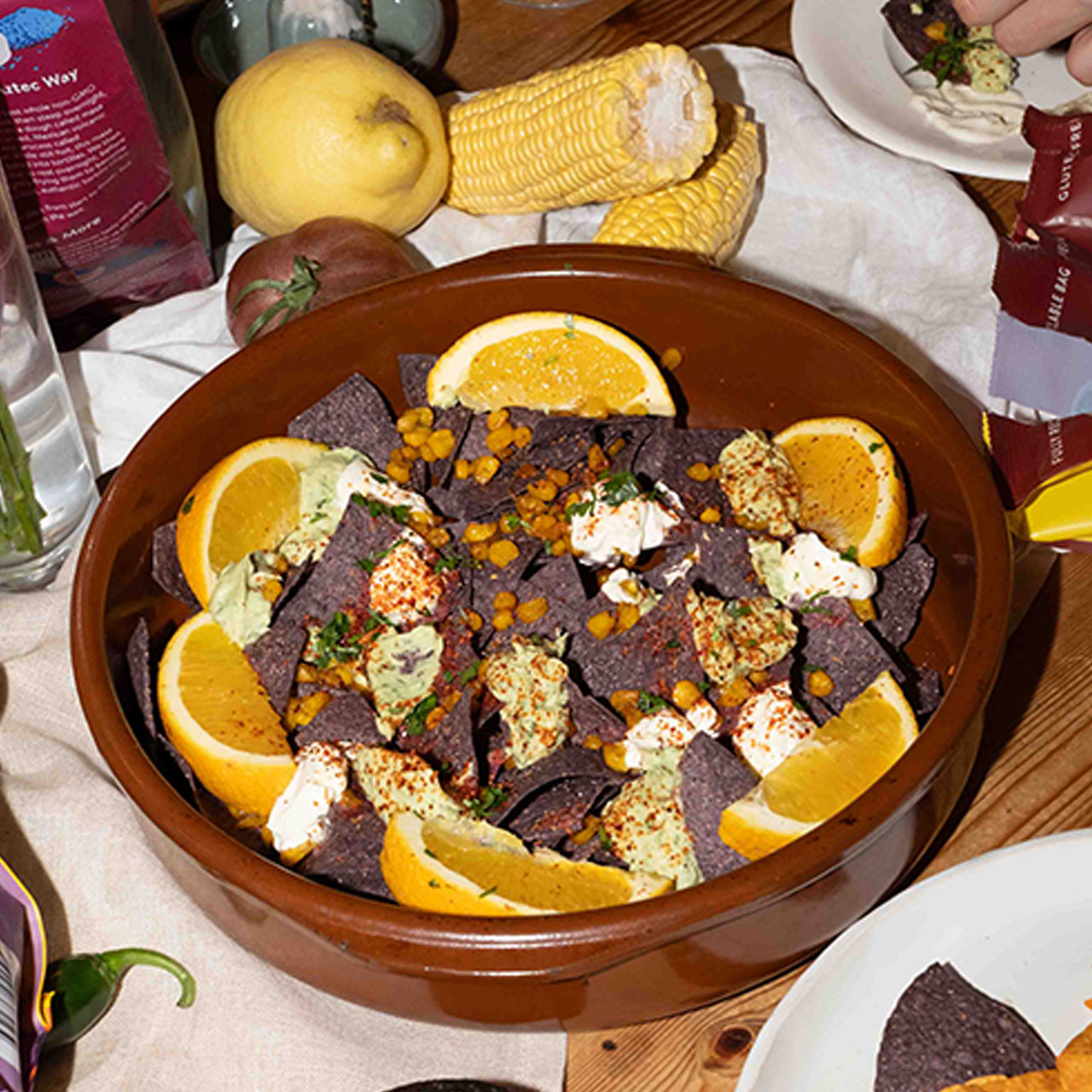 Loaded Nachos with Charred Corn, Avocado Crema and Creme Freiche