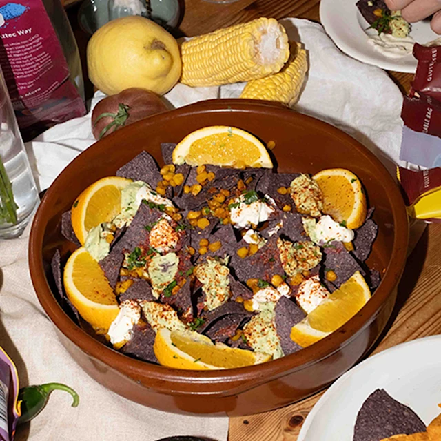 Loaded Nachos with Charred Corn, Avocado Crema and Creme Freiche