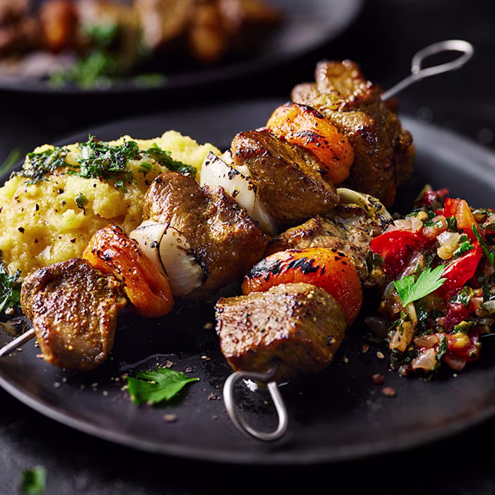Sosaties with Apricots, Creamy Polenta and Fresh Tomato Relish