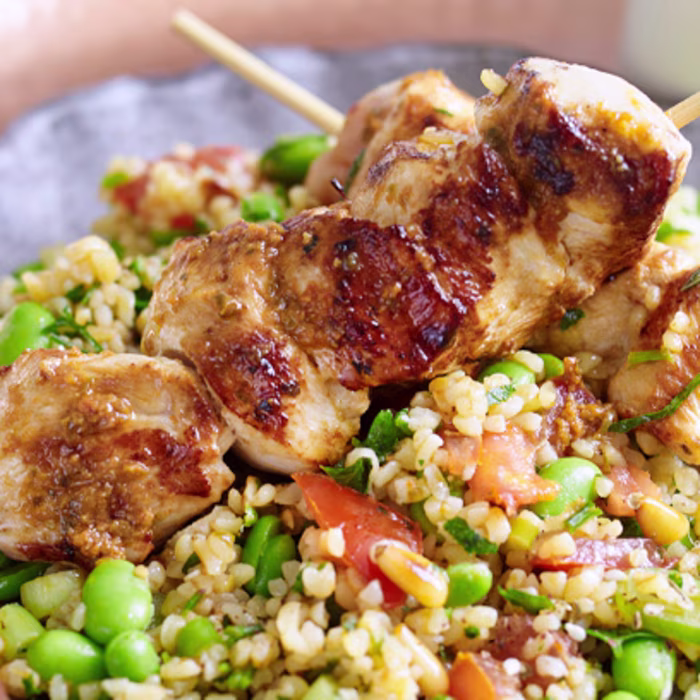 Broad bean tabbouleh salad with tomato pesto and chicken skewers
