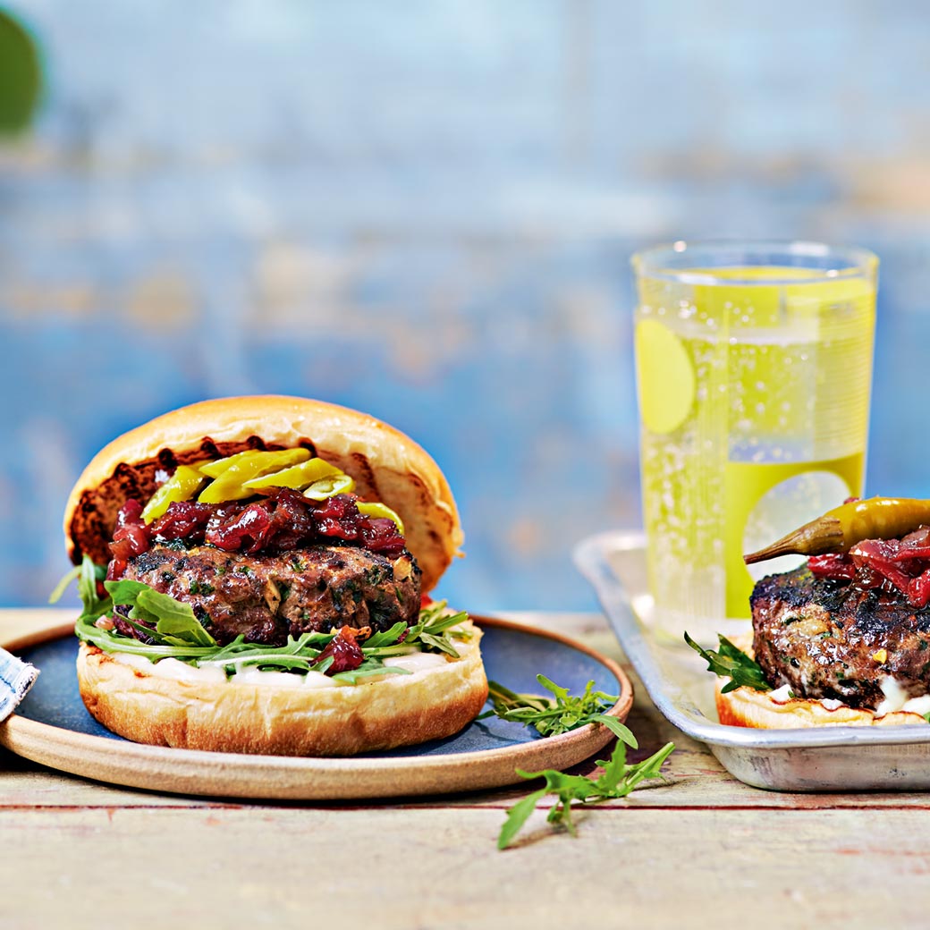 Lamb kofte burger with roasted red pepper chutney, rocket and pickled chillies