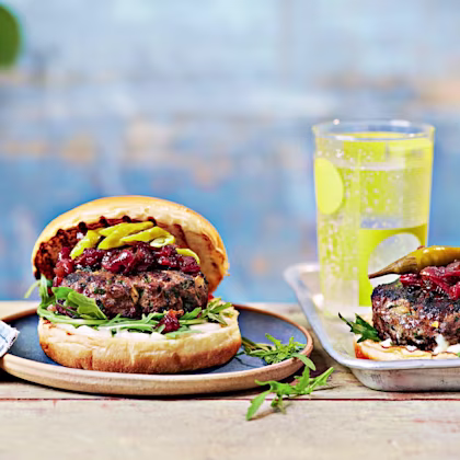 Lamb kofte burger with roasted red pepper chutney, rocket and pickled chillies