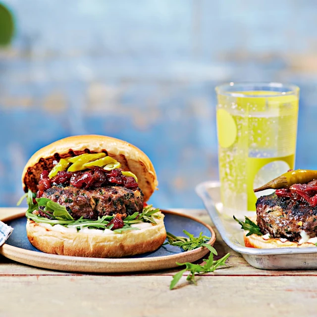 Lamb kofte burger with roasted red pepper chutney, rocket and pickled chillies