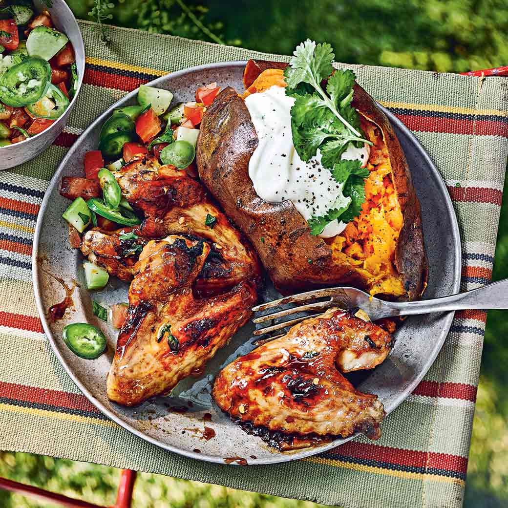 Chicken wings with tamarind, ginger and thyme, baked sweet potatoes and chopped salad