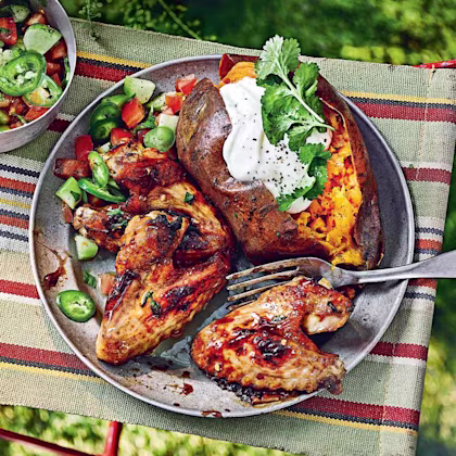 Chicken wings with tamarind, ginger and thyme, baked sweet potatoes and chopped salad