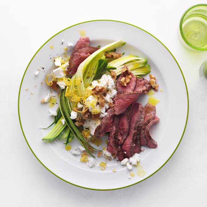 Rump steak with courgette, lemony feta and walnuts