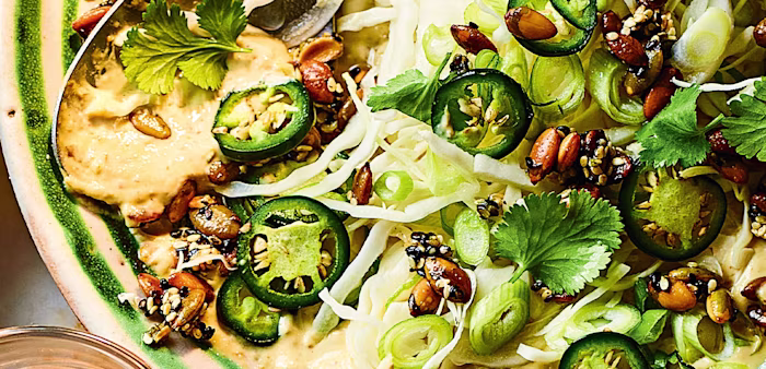 Vibrant green and spicy slaw with creamy tahini by celebrity chef, Yotam Ottolenghi.