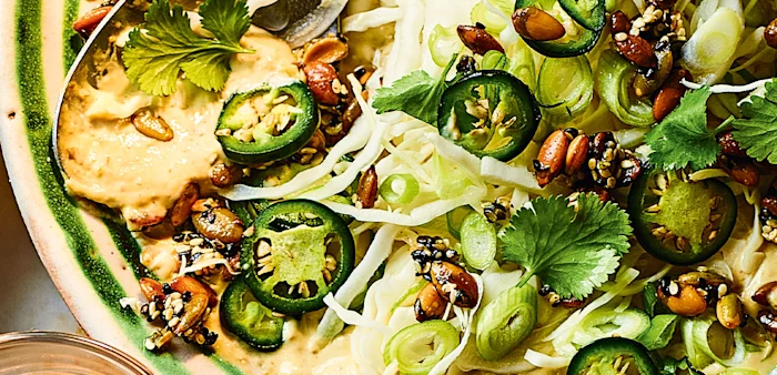 Vibrant green and spicy slaw with creamy tahini by celebrity chef, Yotam Ottolenghi.