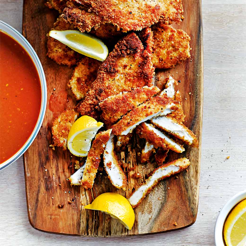Breaded pan-fried chicken with fresh tomato sauce