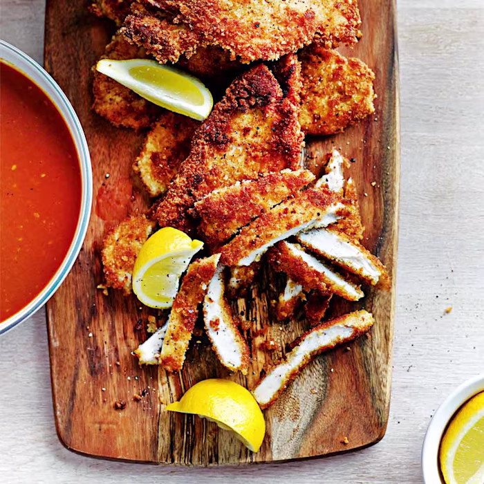 Breaded pan-fried chicken with fresh tomato sauce