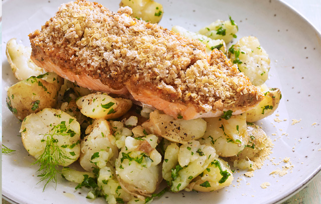 Tomato pesto salmon with crushed parsley new potatoes