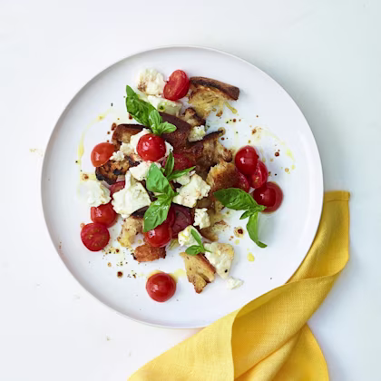 Cherry tomatoes baked with feta and torn bread