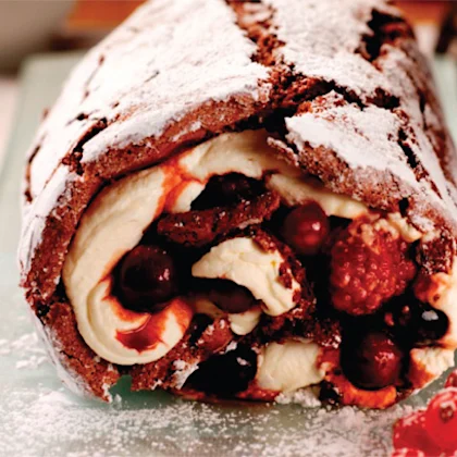 Chocolate roulade with spiced berry compote and cointreau cream