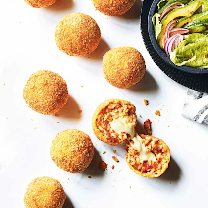 Sundried tomato and mozzarella arancini with a green salad