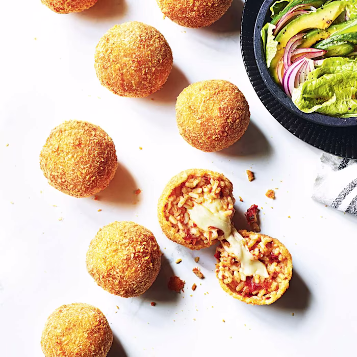 Sundried tomato and mozzarella arancini with a green salad