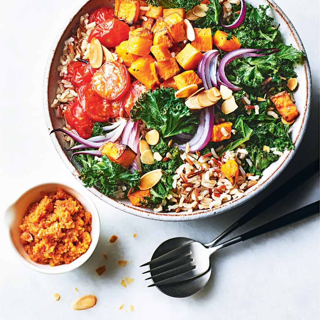 Roasted vegetable and wild rice Buddha bowl with romesco sauce
