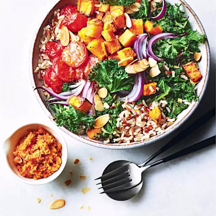 Roasted vegetable and wild rice Buddha bowl with romesco sauce