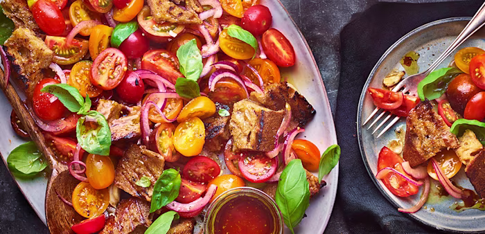 Tom Kerridge's summer tomato and sourdough salad, think panzanella with all the bright and vibrant characteristics of juicy, in season tomatoes with crispy olive oil-laden croutons.