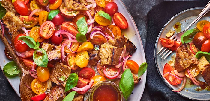 Tom Kerridge's summer tomato and sourdough salad, think panzanella with all the bright and vibrant characteristics of juicy, in season tomatoes with crispy olive oil-laden croutons.