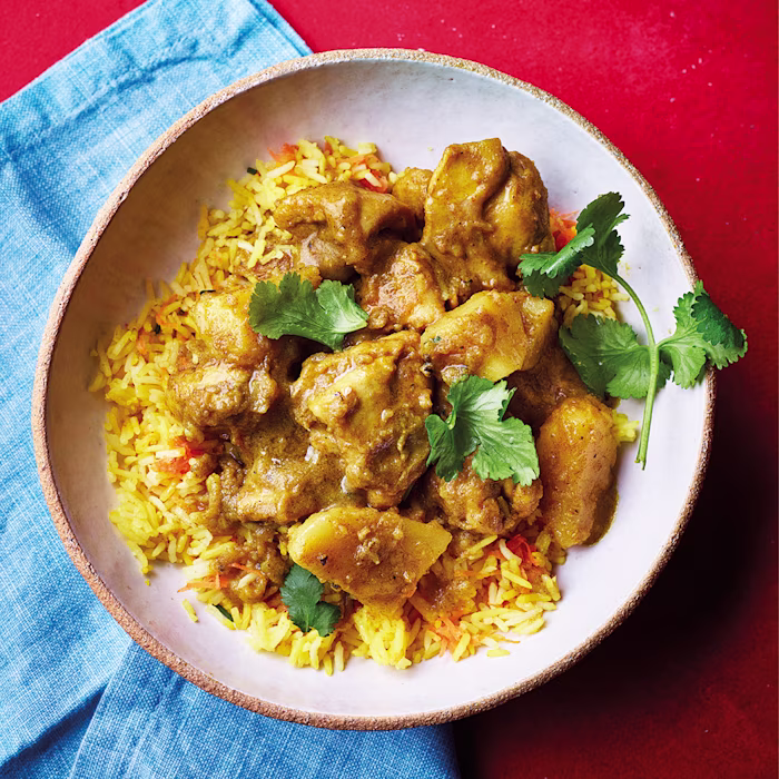 Curry Chicken with Green Seasoning and Golden Rice