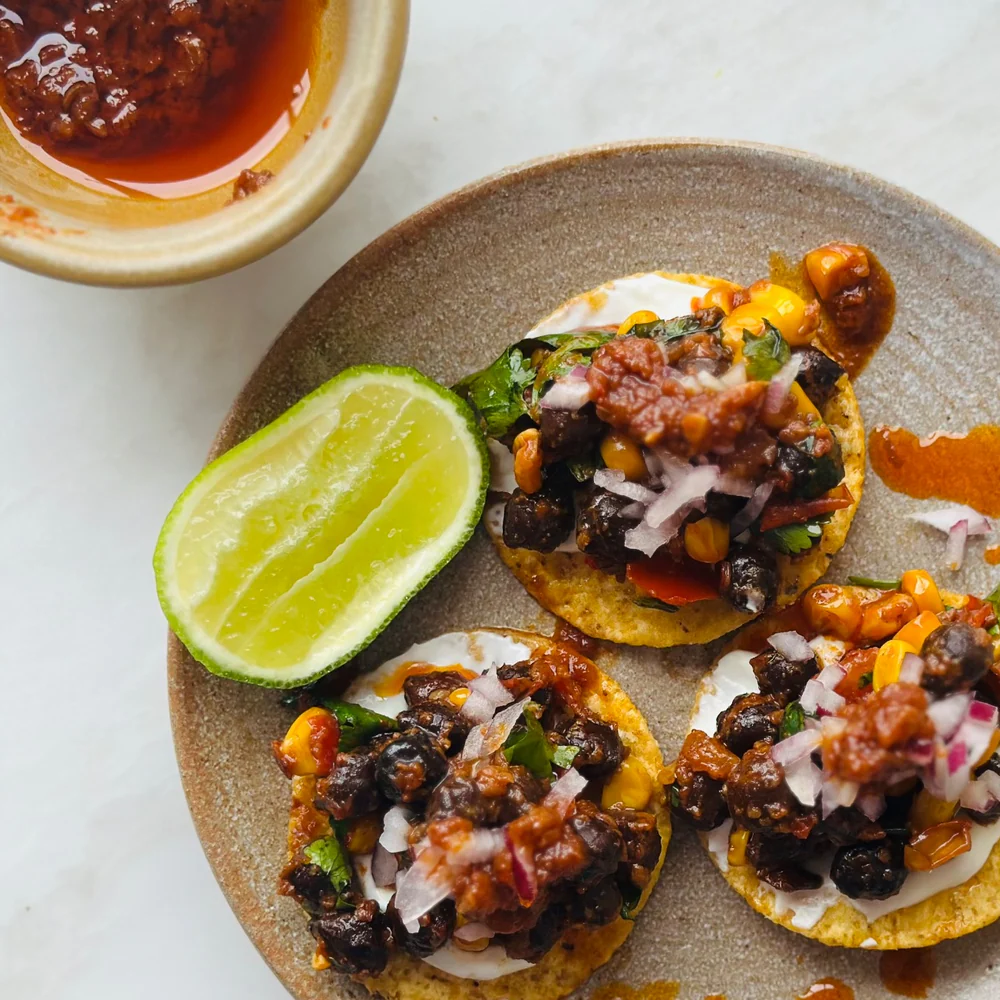 Ottolenghi’s Black Chickpea, Corn and Pilpelchuma Tostadas