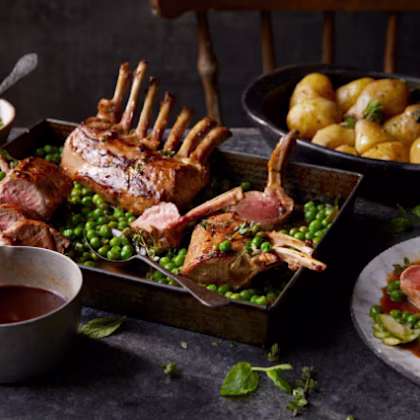 Rack of Lamb with Braised Peas, New Potatoes, Pickled Cucumber & Lamb Sauce