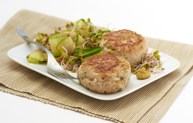 Tuna teriyaki burgers with red radish sprouts and cucumber ribbon salad