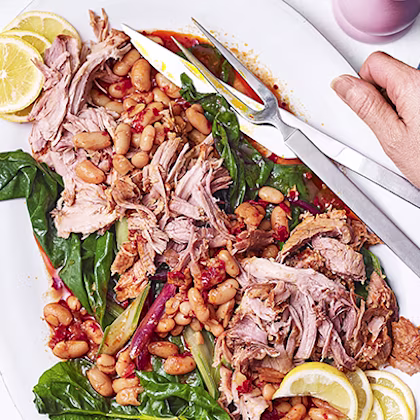 Harissa-rubbed pork shoulder with white beans and chard