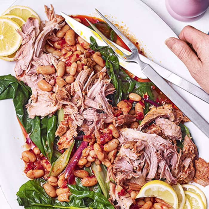 Harissa-rubbed pork shoulder with white beans and chard