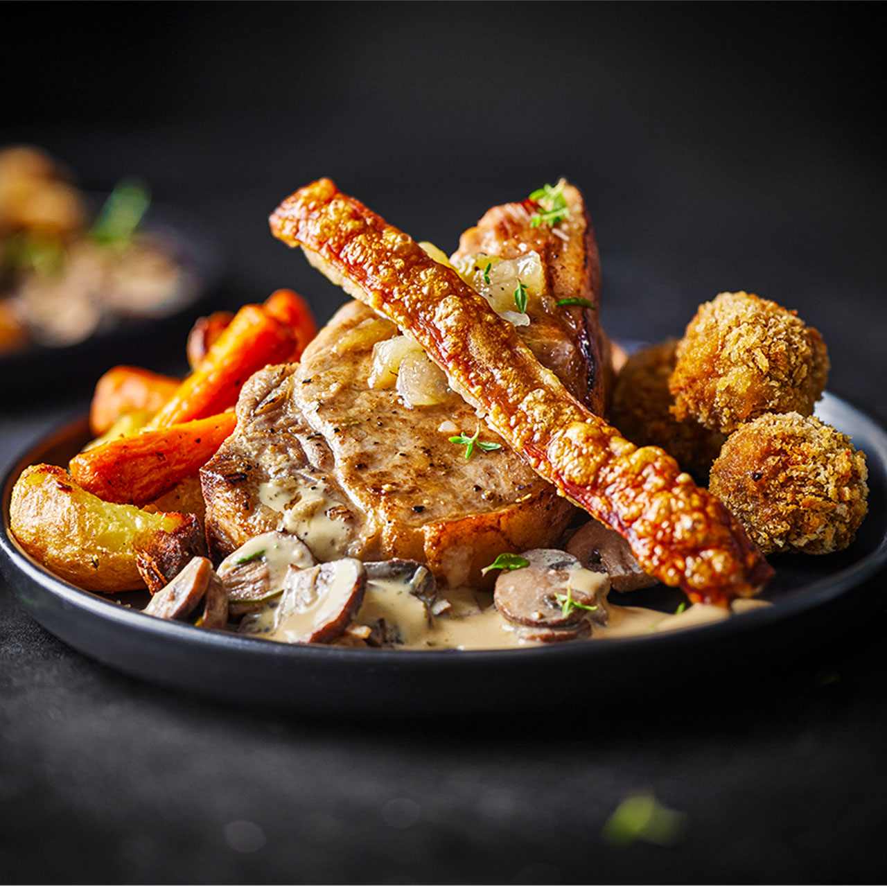 Pan-roast Pork Chops with Crackling and Sausage Bonbons