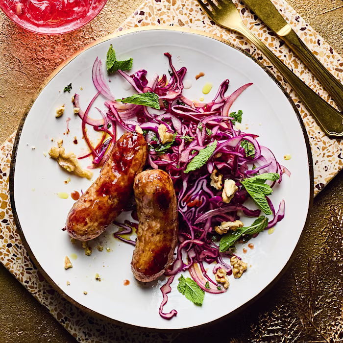 Pomegranate-glazed Sausages with Red Cabbage Slaw