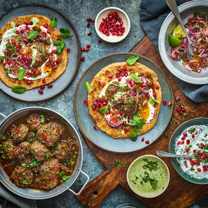 Lamb Vhura with Spicy Onions, Pomegranate Raita, and Coriander Chutney
