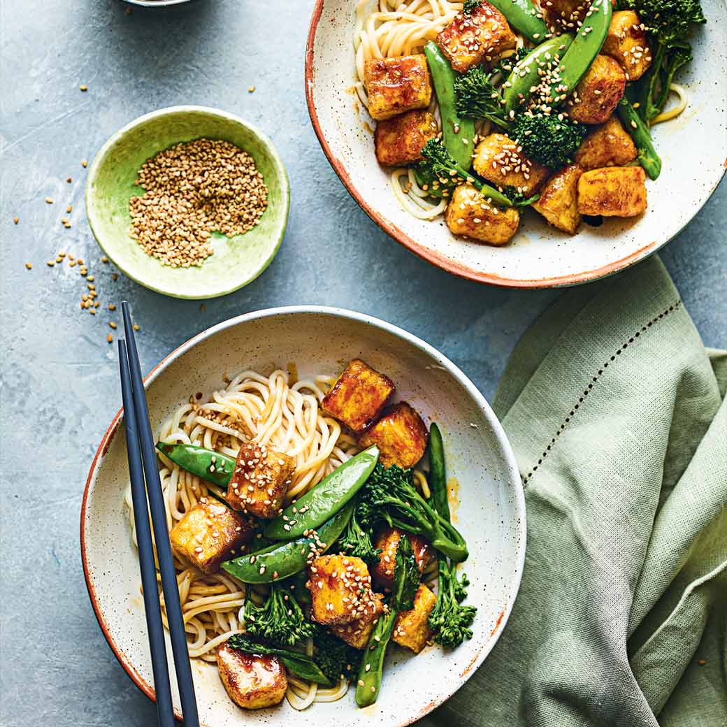 Marmite tofu with spring onions, broccoli, sugar snap peas and noodles