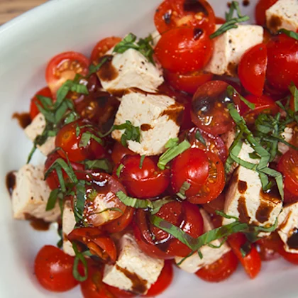 Cauldron Tofu Block with Cherry Tomato, Balsamic Glaze, Olive Oil, Cracked Black Pepper and Basil